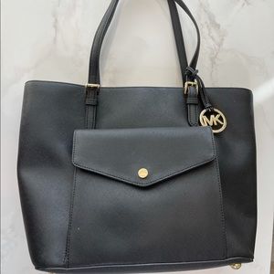 Black and gold Michael Kohrs shoulder bag